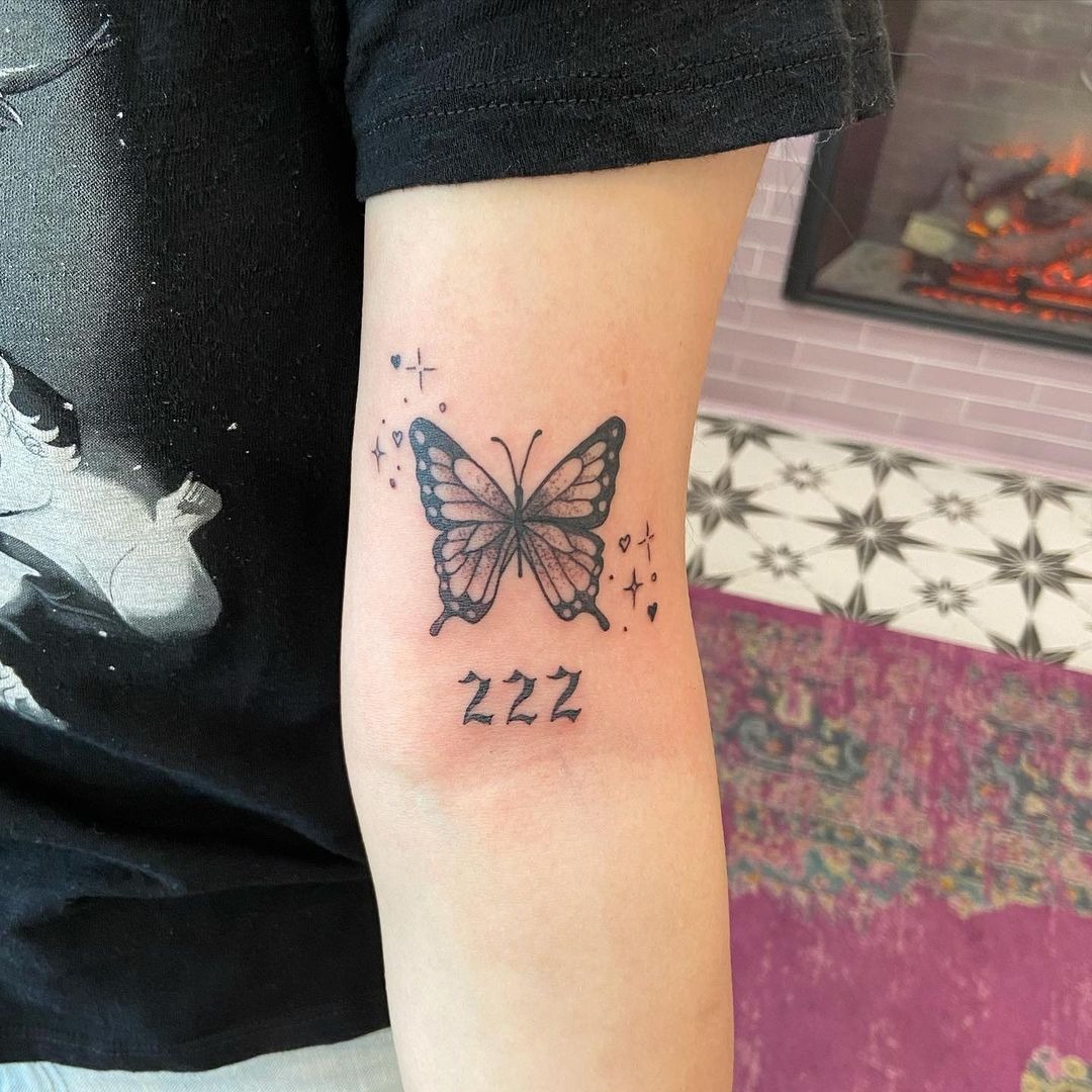 Butterfly and 222 with Sparkle Accents, a tattoo design rendered in clean detailed linework.