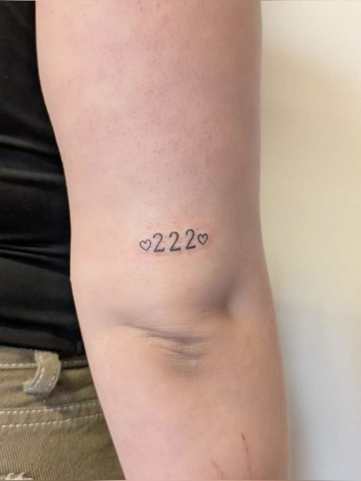 Hearts Framing 222, a tattoo design rendered in clean detailed linework.