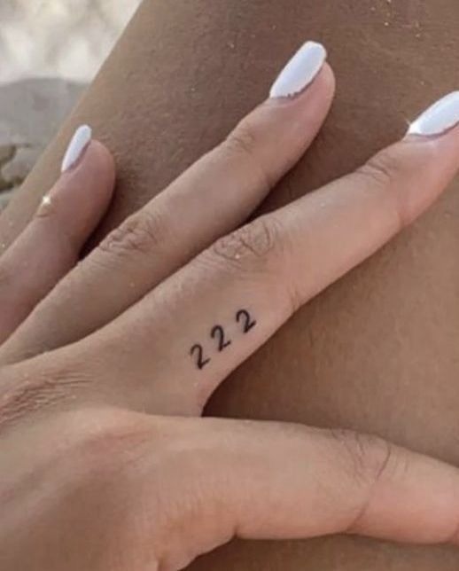 Minimal Finger 222, a tattoo design rendered in delicate fine-line for the arm.