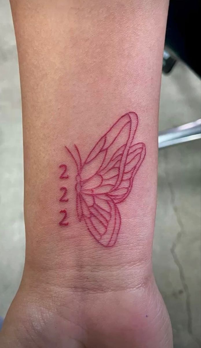Red Ink Butterfly with 222, a tattoo design rendered in delicate fine-line for the arm.
