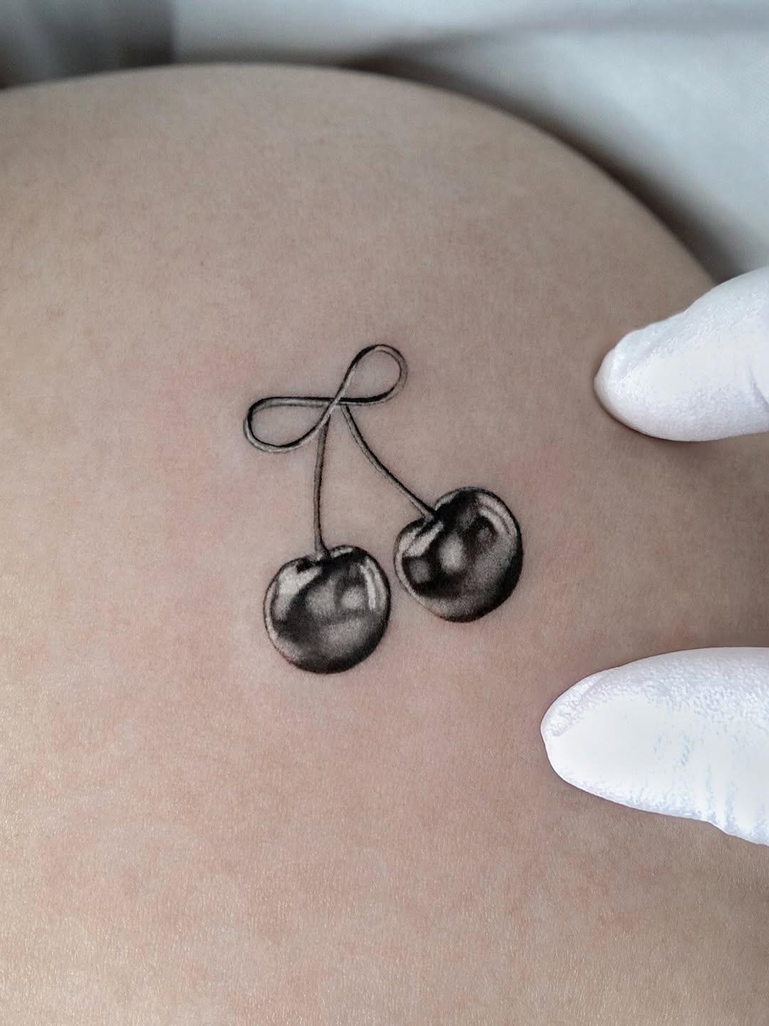 Delicate 3D Cherry Tattoo on Skin Tattoo Design
