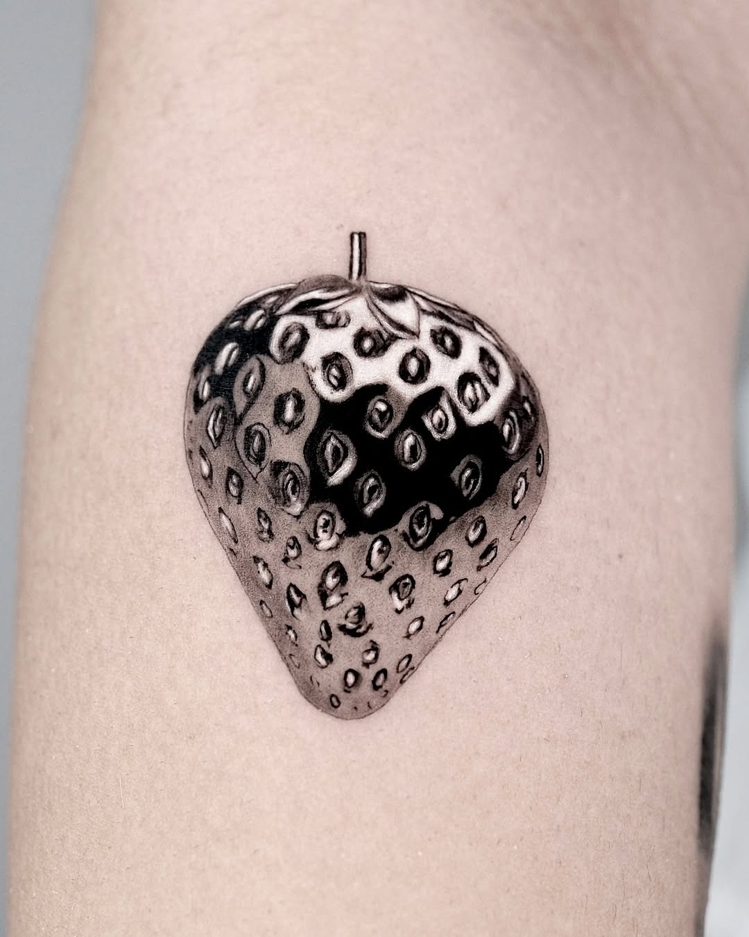 Intricate 3D strawberry tattoo on skin Tattoo Design