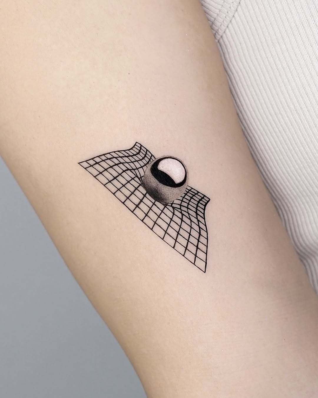 Intriguing 3D illusion tattoo on arm Tattoo Design