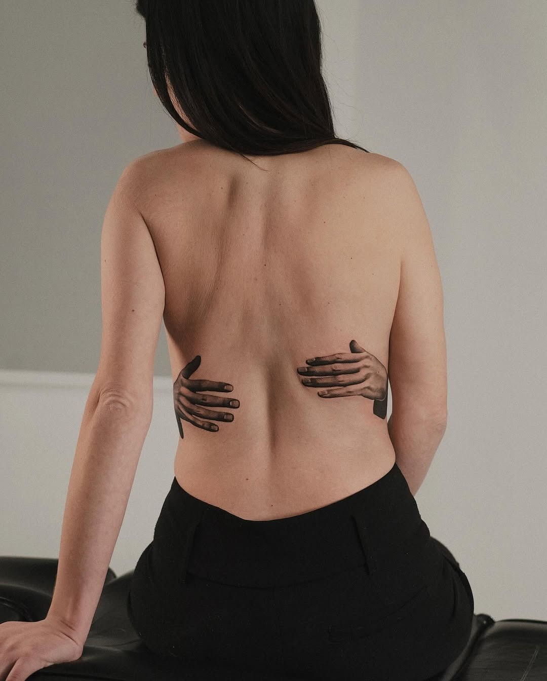 Unique 3D hands tattoo on back Tattoo Design