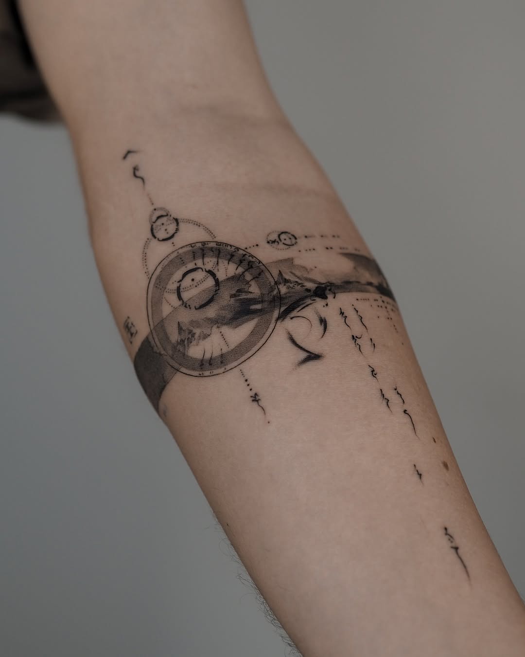 This tattoo features bold black lines interwoven with geometric shapes, creating a stunning visual effect.