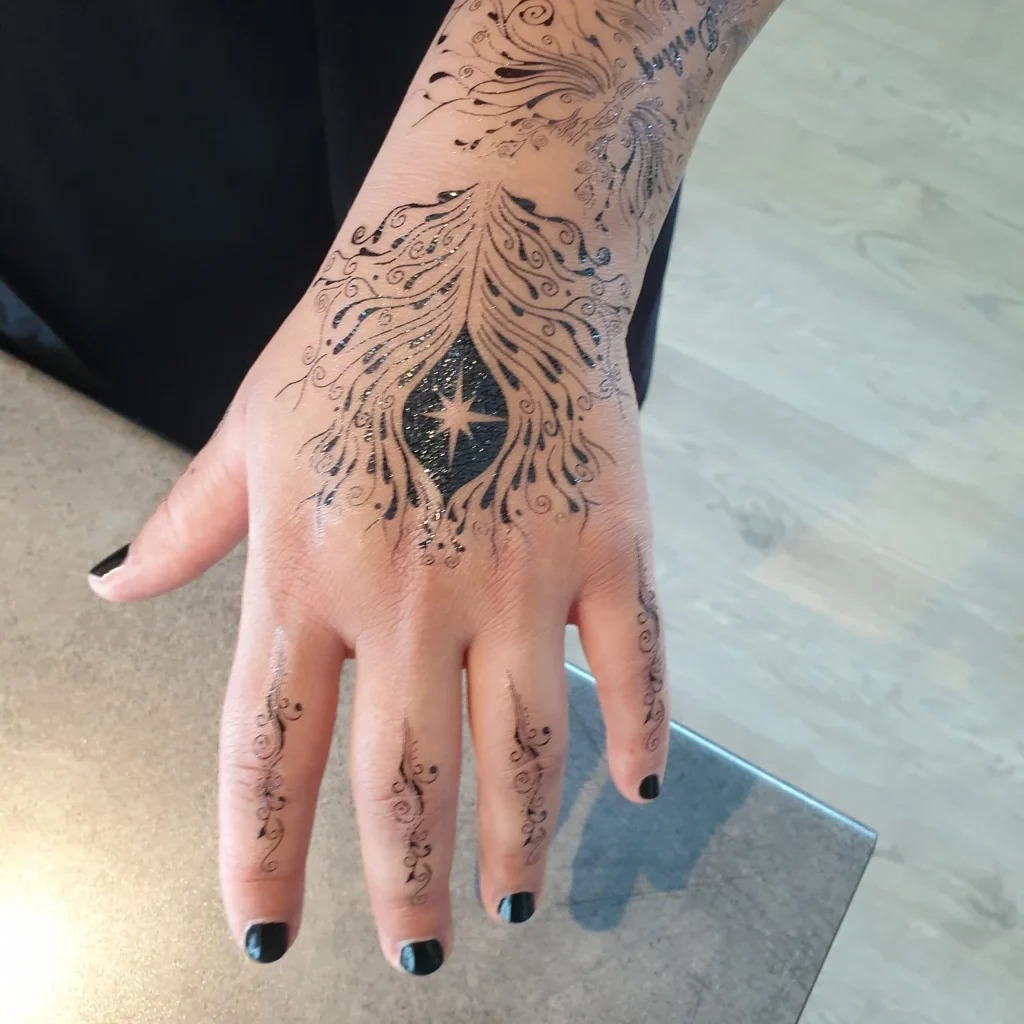 Elaborate Hand Tattoo with Night Court Elements Tattoo Design