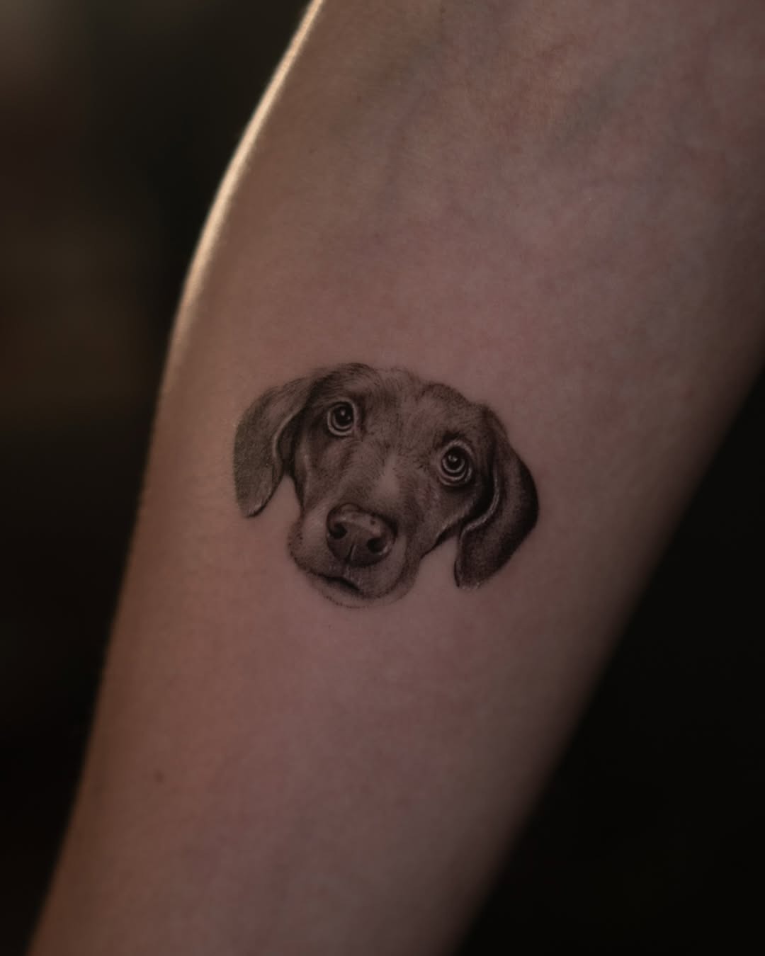 Adorable puppy tattoo with floral accents Tattoo Design