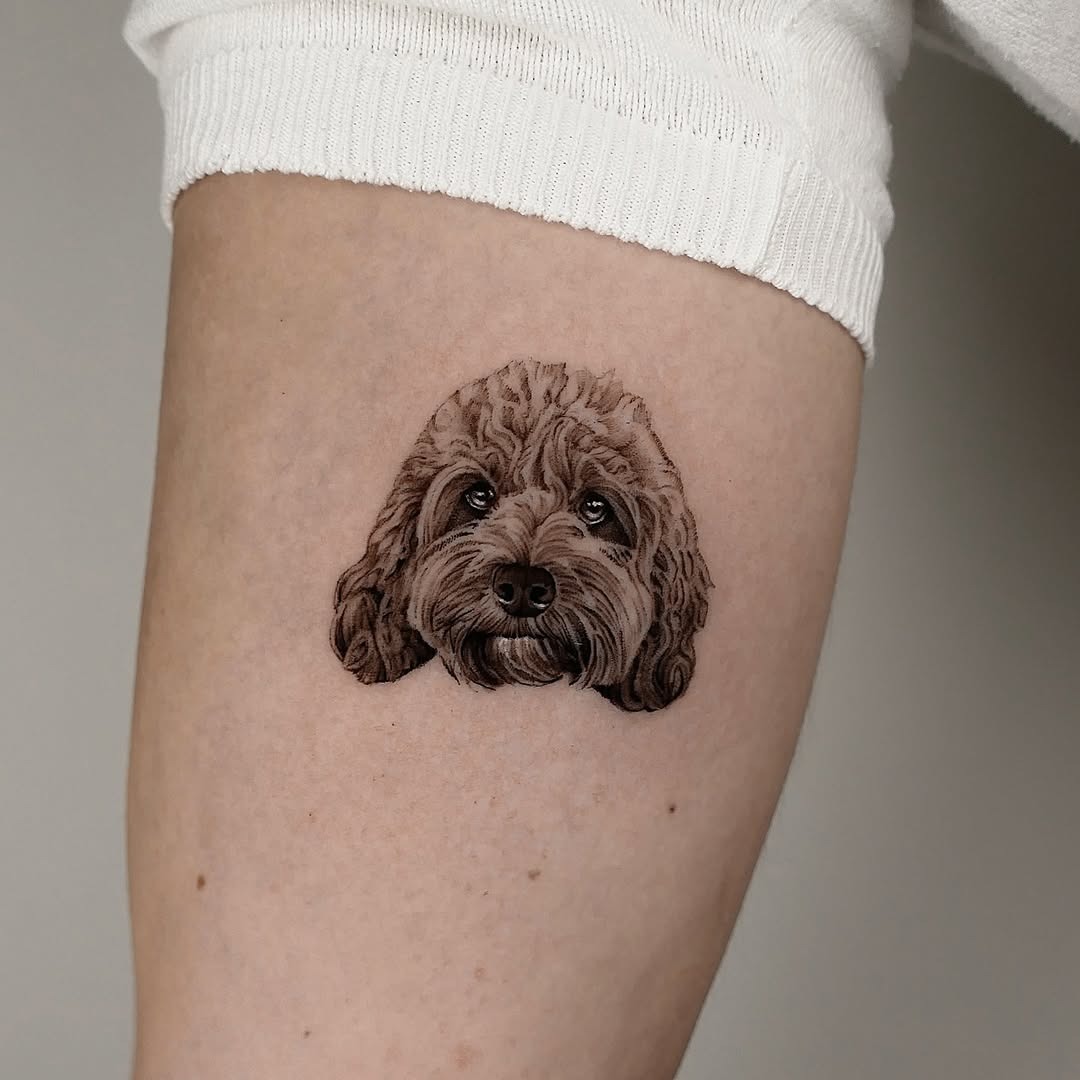 Adorable realistic dog tattoo on thigh Tattoo Design