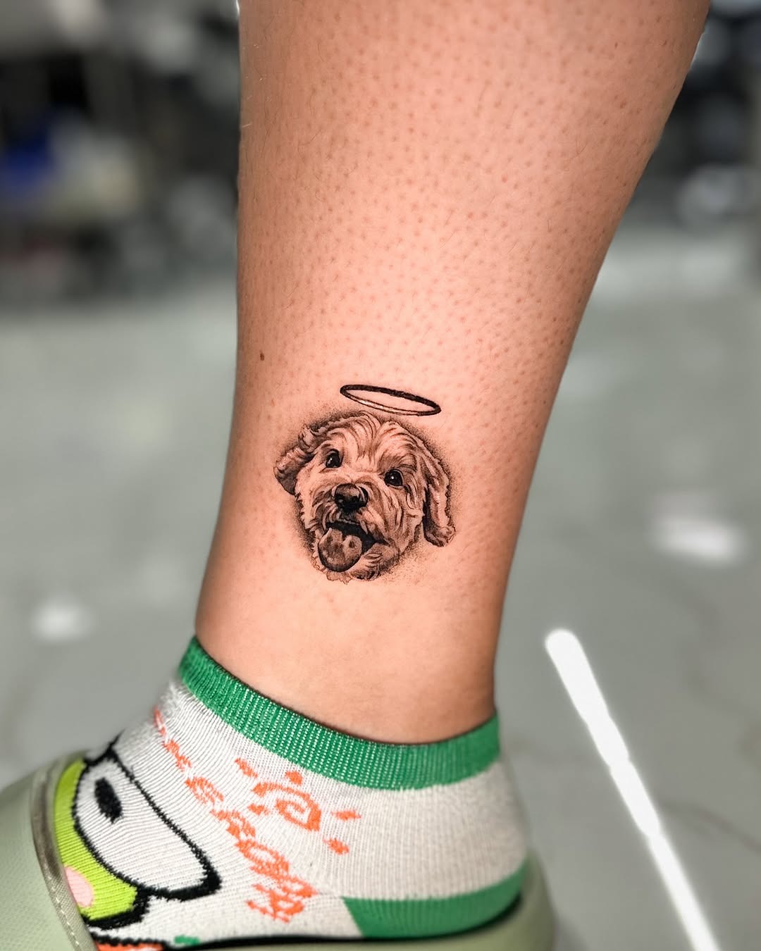 Charming dog tattoo with an angelic touch Tattoo Design