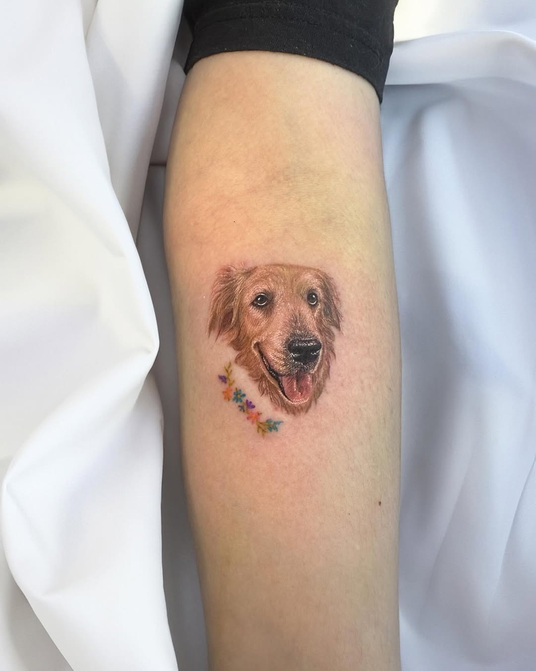 Charming Golden Retriever Tattoo with Floral Accents Tattoo Design
