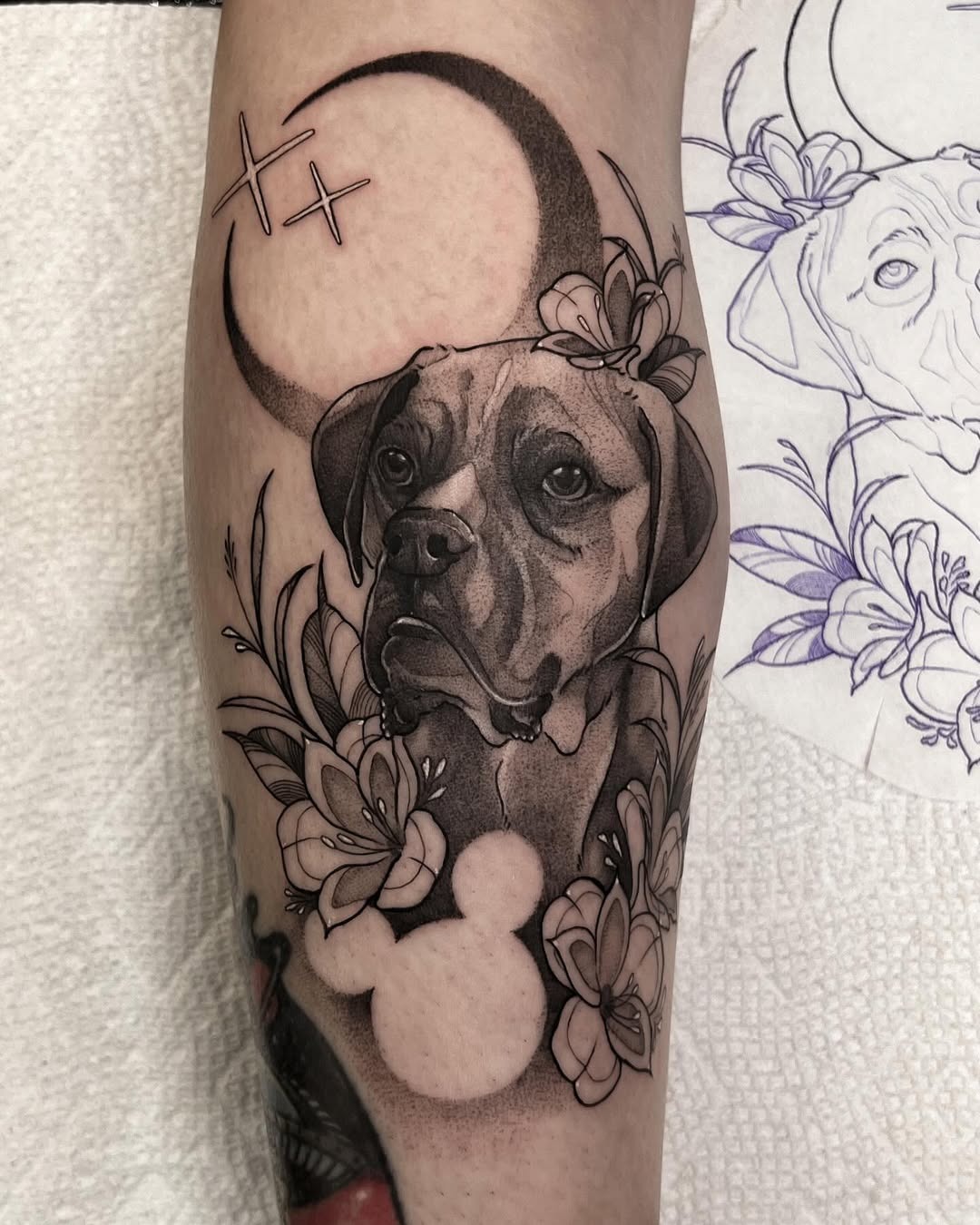 Elegant Dog Tattoo with Floral Accompaniments Tattoo Design