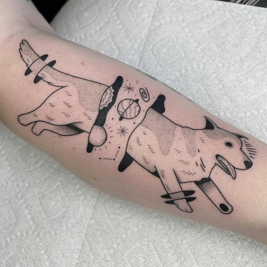 Inked tribute to playful dog companions Tattoo Design