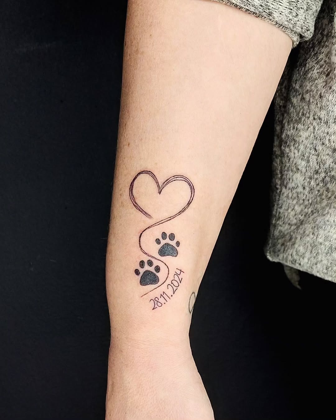 Meaningful dog paw print tattoo with heart Tattoo Design