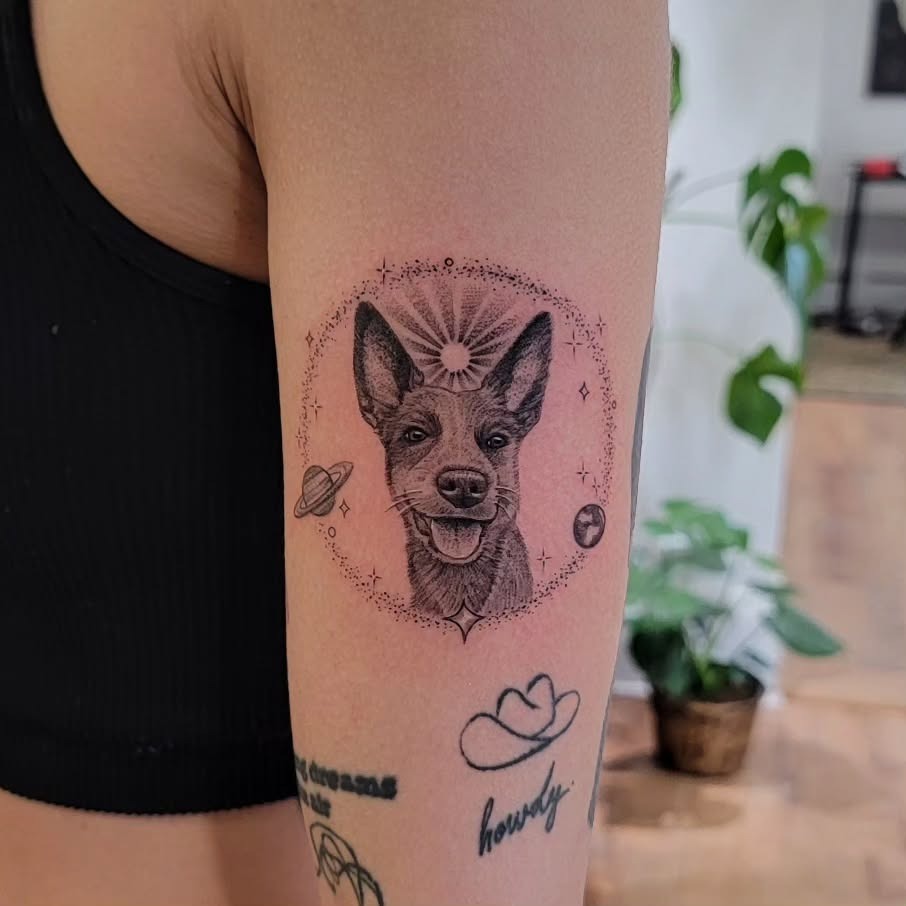Stylish dog tattoo with celestial elements Tattoo Design