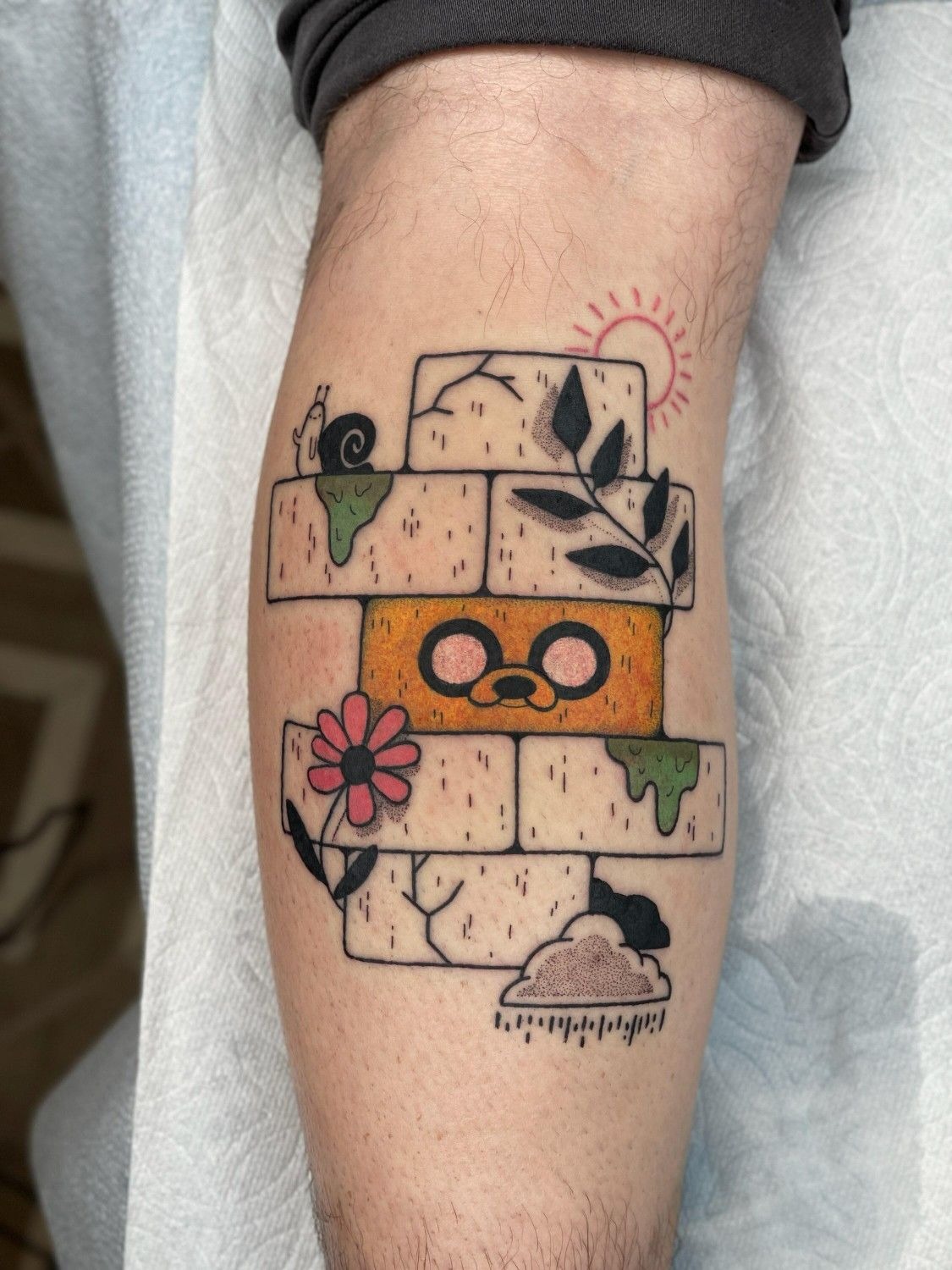 Jake Brick Wall Peekaboo Tattoo With Snail Detail Tattoo Design