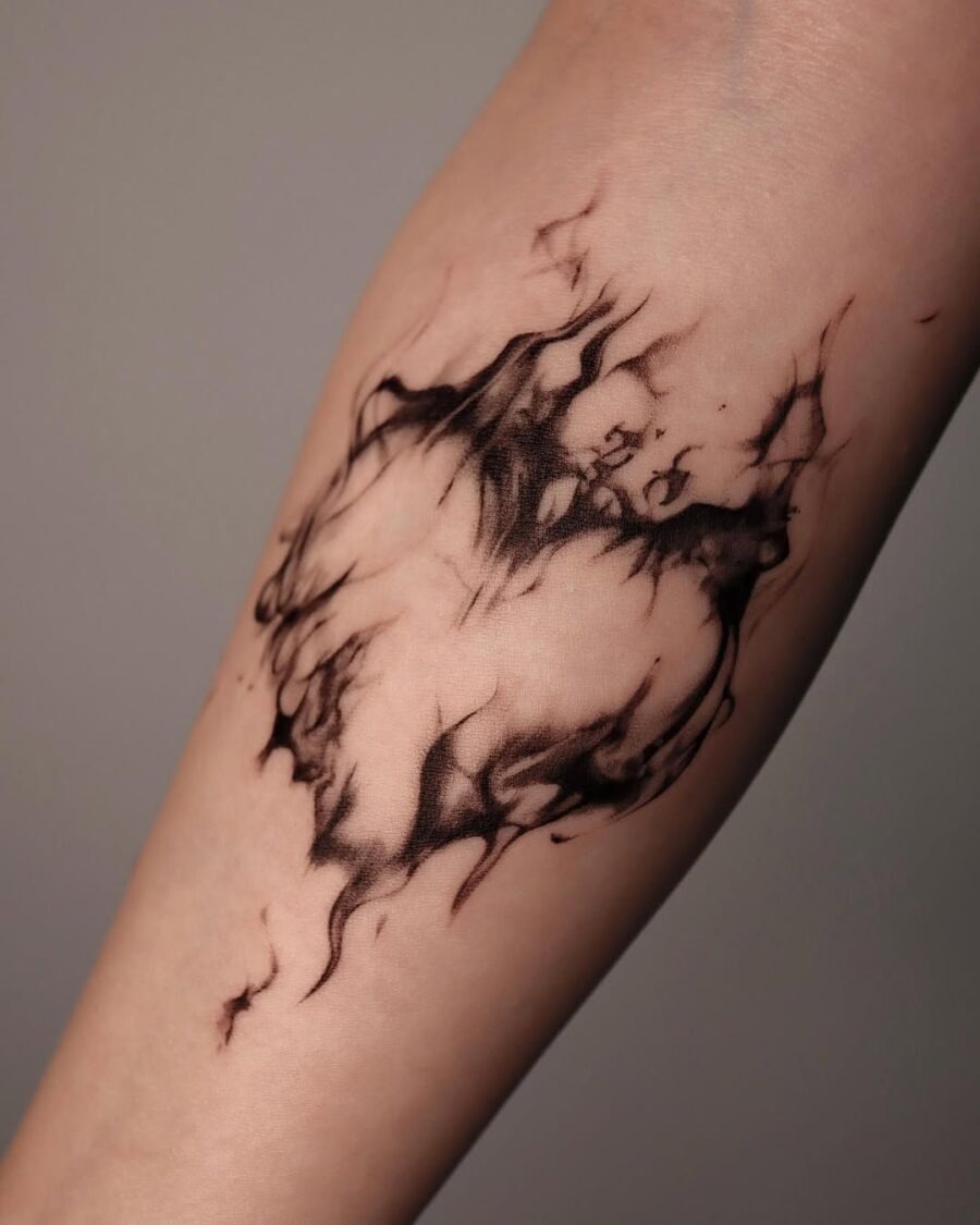 This tattoo features a stunning abstract design that seems to evolve from the skin itself.