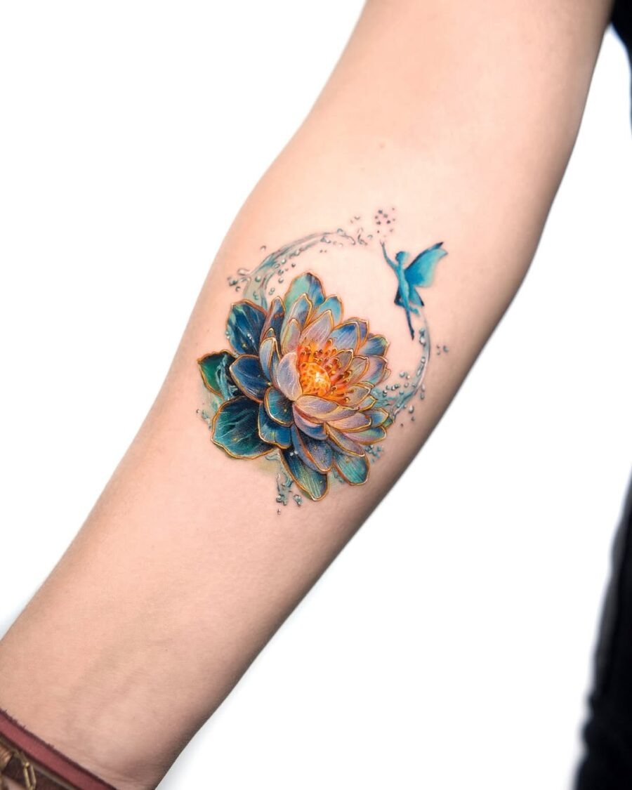 This stunning lotus tattoo features an array of hues, highlighting delicate petals and intricate detailing.