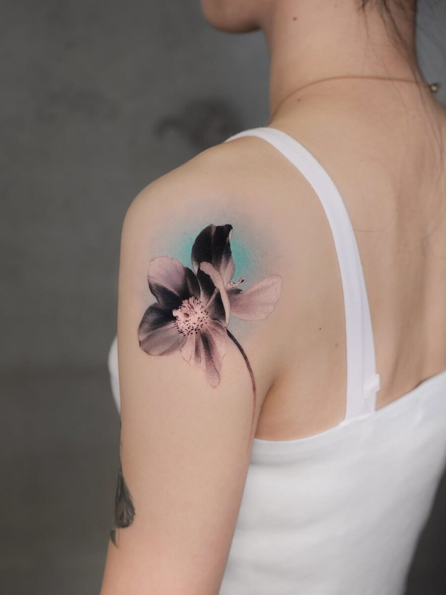This tattoo features a beautifully intricate lamp design, showing a delicate fabric shade and ornate base.