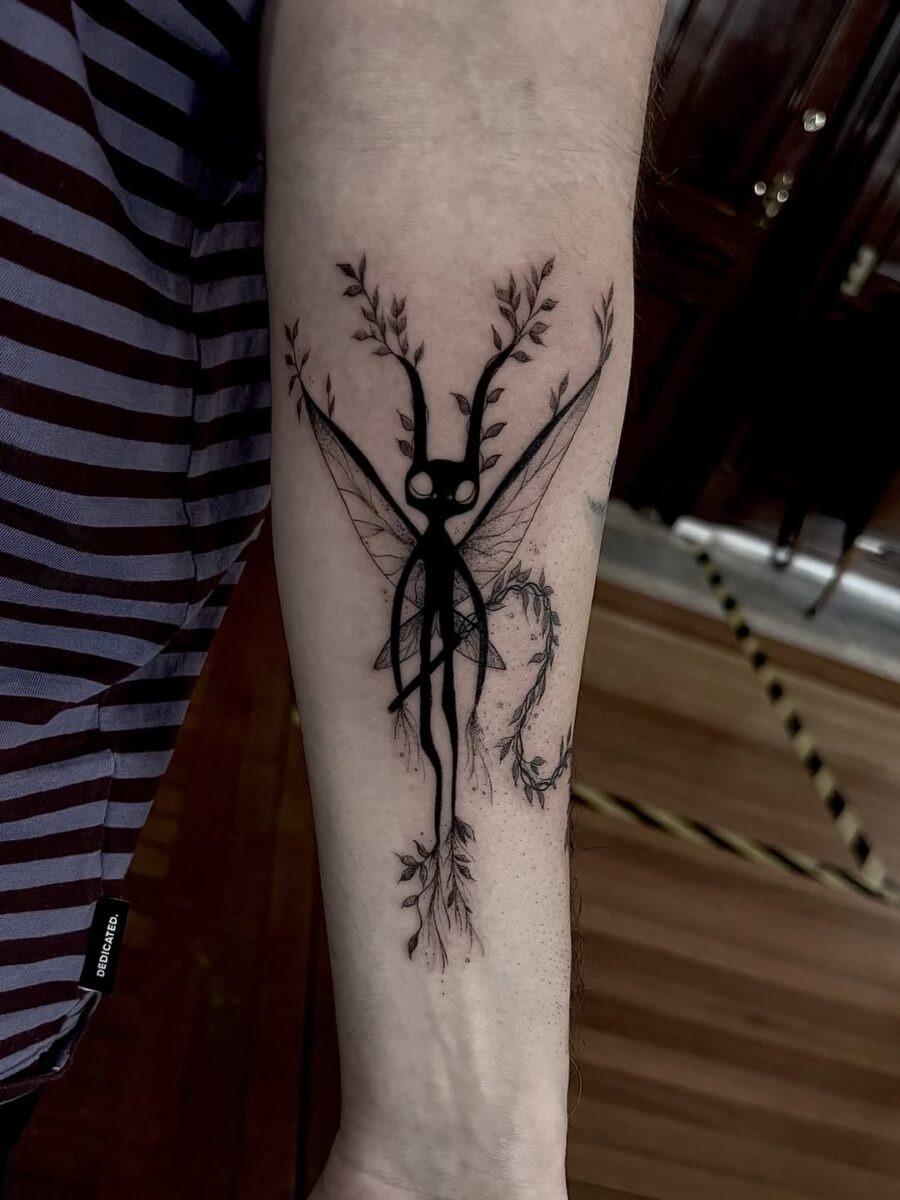 This stunning tattoo features an ethereal fairy adorned with intricate details and organic motifs.