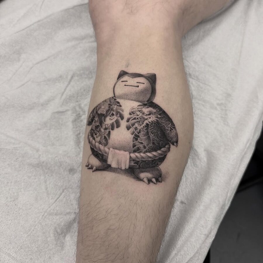 This tattoo features Snorlax, the beloved Pokémon, in a captivating black and gray style.