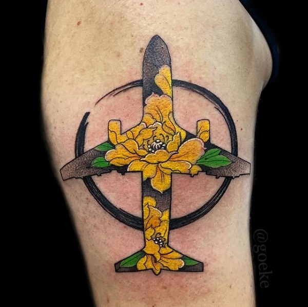 Beautiful airplane tattoo with floral elements Tattoo Design