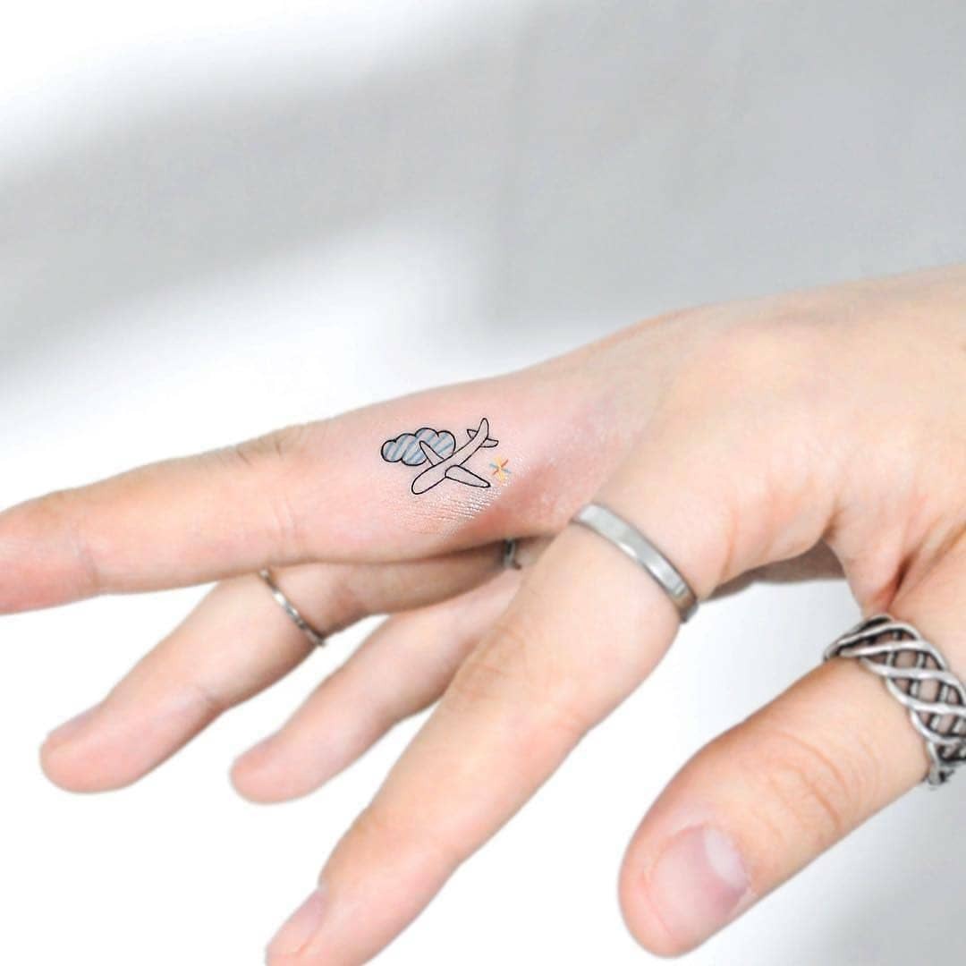 Charming airplane tattoo on the hand Tattoo Design