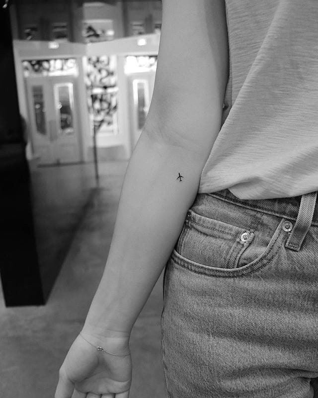 Elegant airplane tattoo on the forearm Tattoo Design