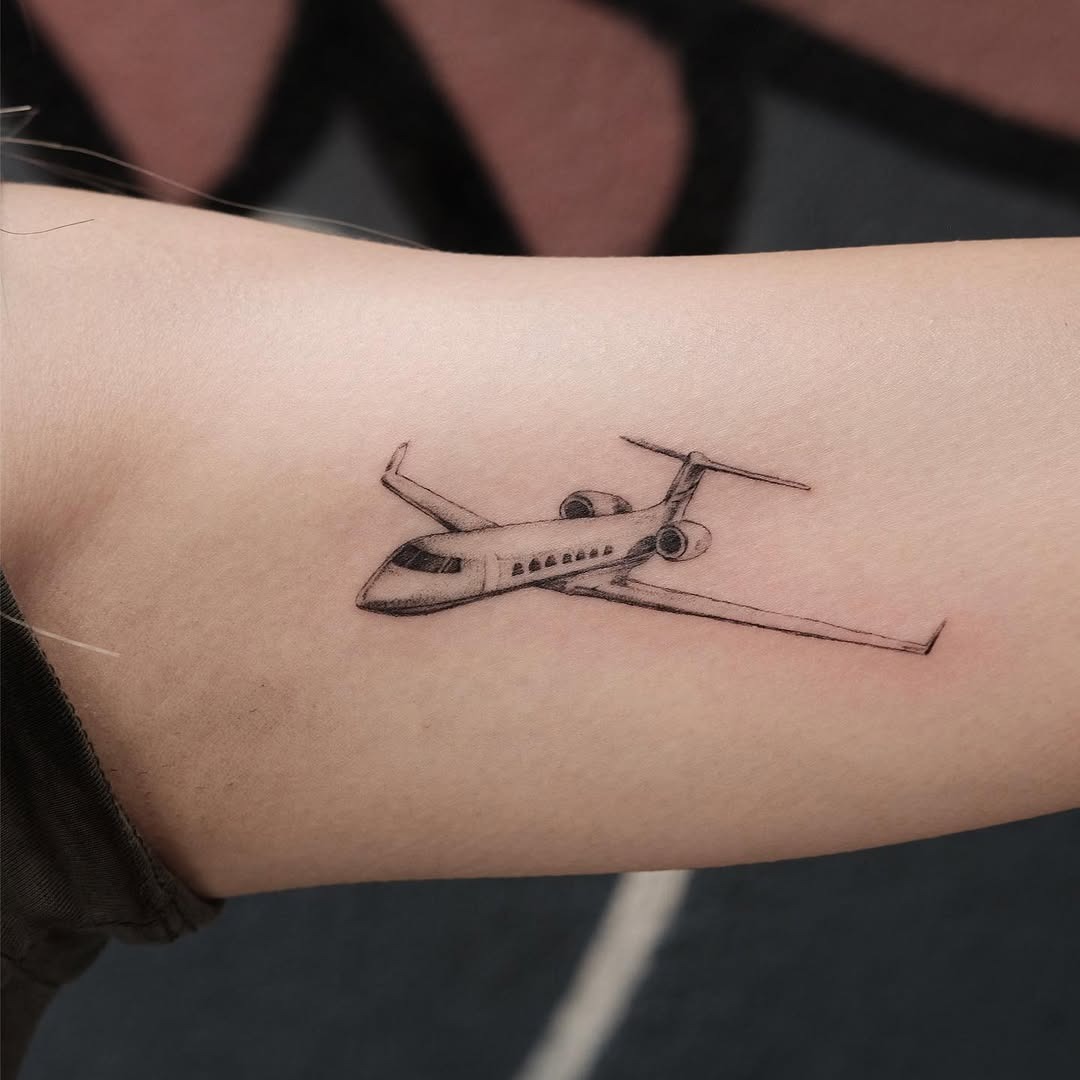 Minimalist airplane tattoo for aviation lovers Tattoo Design