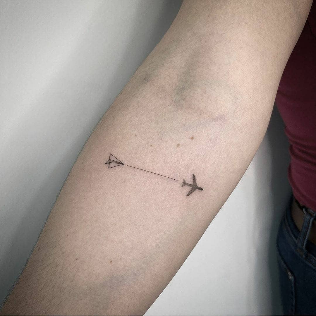 Minimalist airplane tattoo for travel enthusiasts Tattoo Design