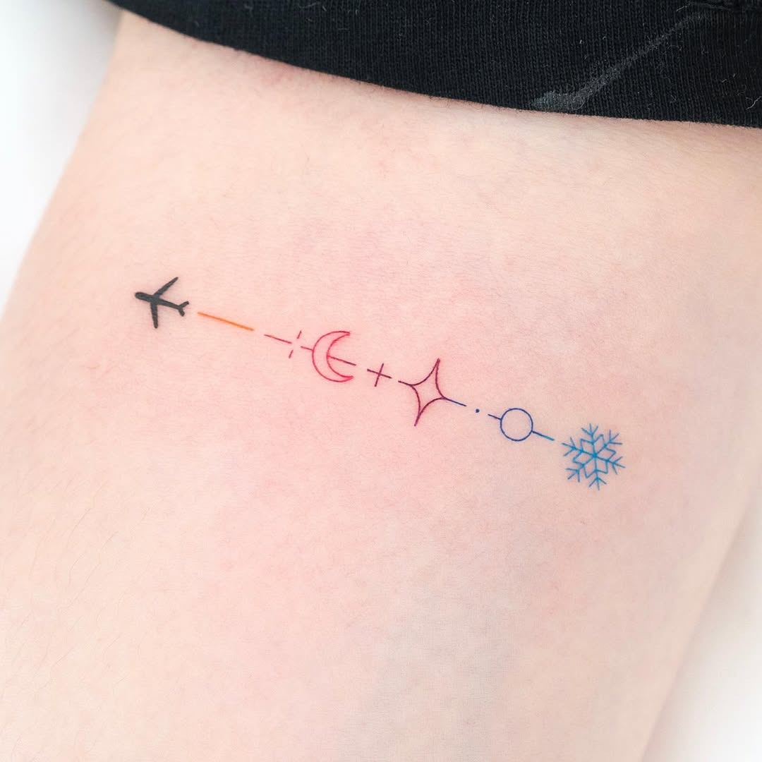 Minimalist Airplane Tattoo with Celestial Elements Tattoo Design