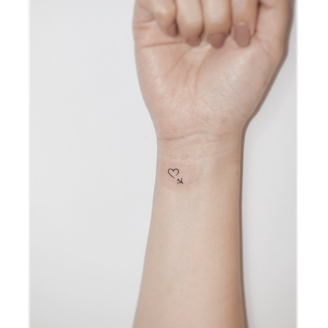 Minimalist Airplane Tattoo with Heart Accent Tattoo Design