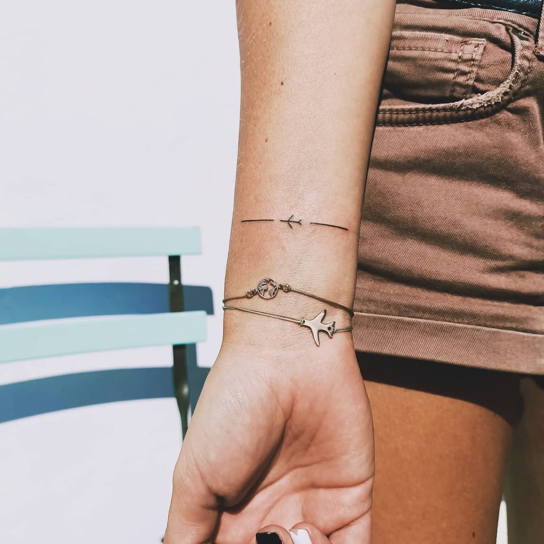 Minimalist Airplane Tattoo with Simple Lines Tattoo Design