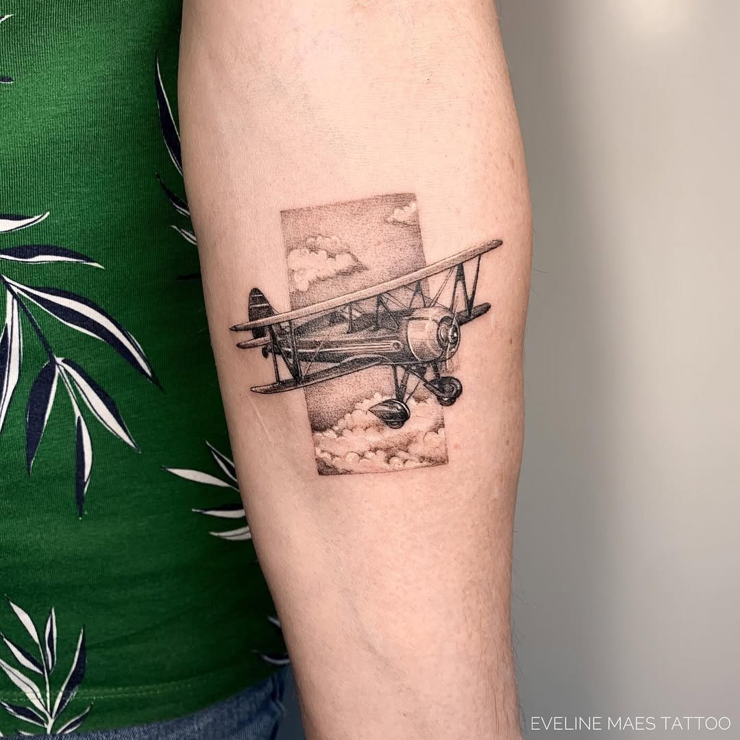 Stunning Vintage Airplane Tattoo with Clouds Tattoo Design