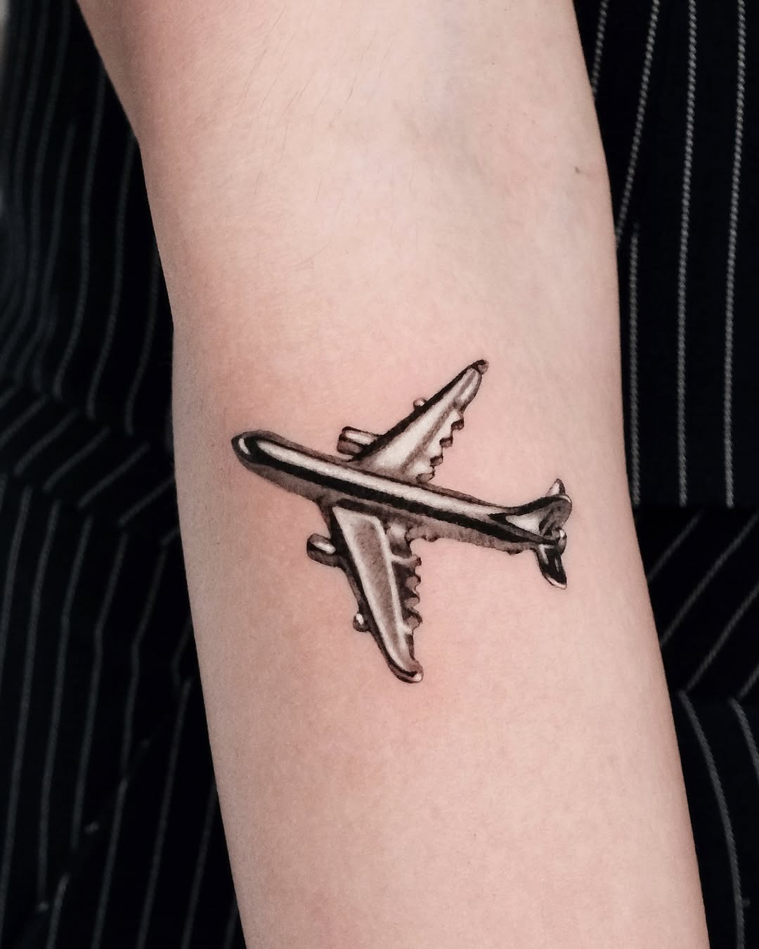 Stylish airplane tattoo on a unique location Tattoo Design