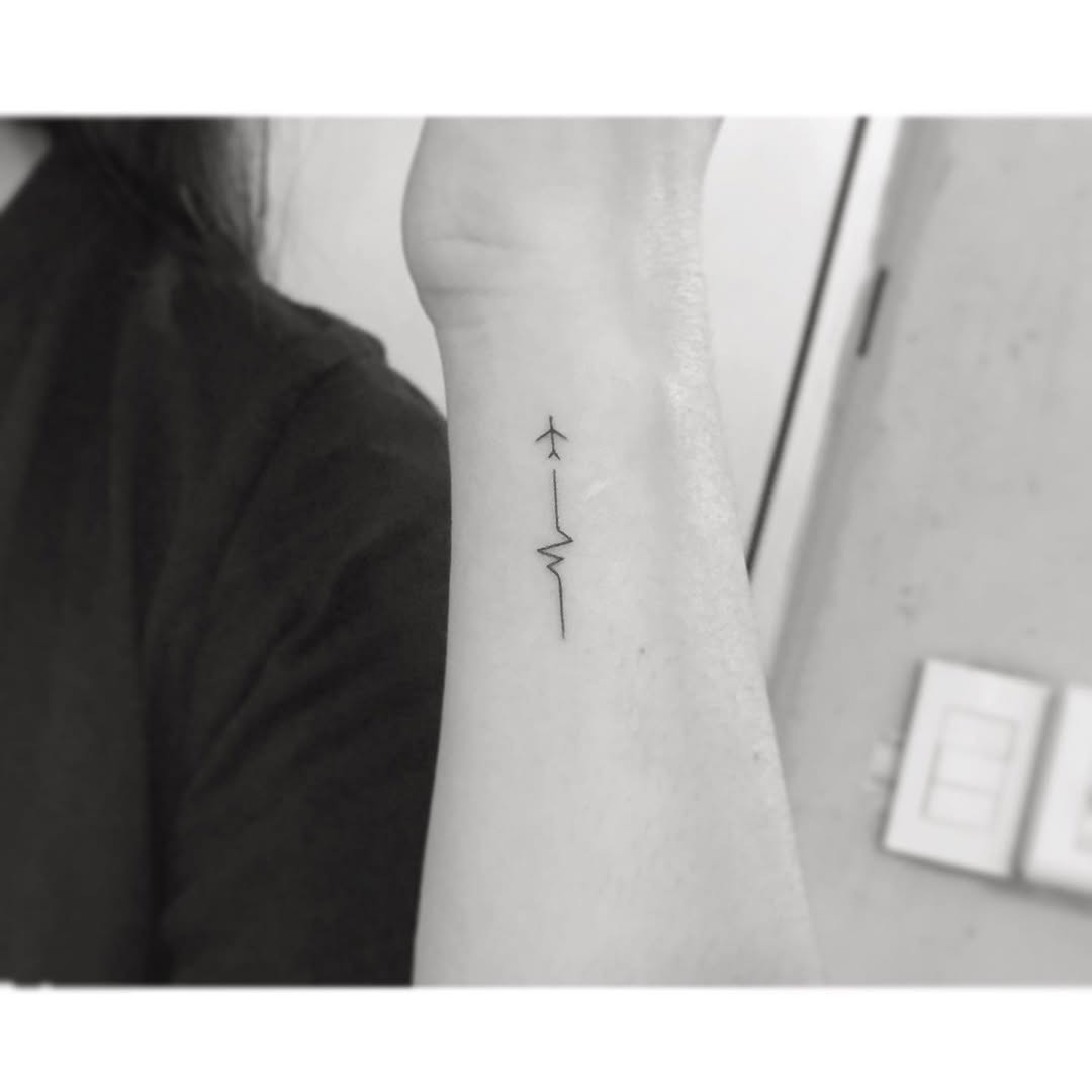 Stylish minimalistic airplane tattoo design Tattoo Design
