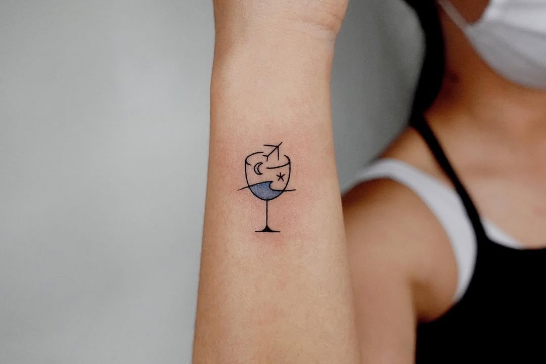 Unique airplane cocktail glass tattoo design Tattoo Design