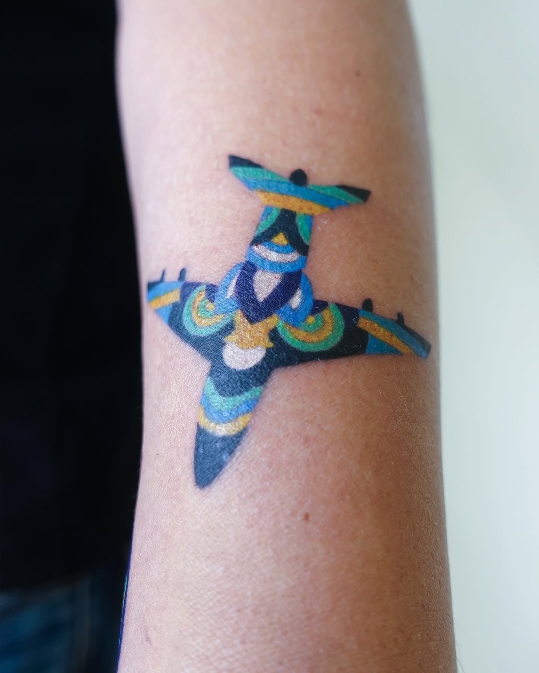 Vibrant airplane tattoo showcasing artistic flair Tattoo Design