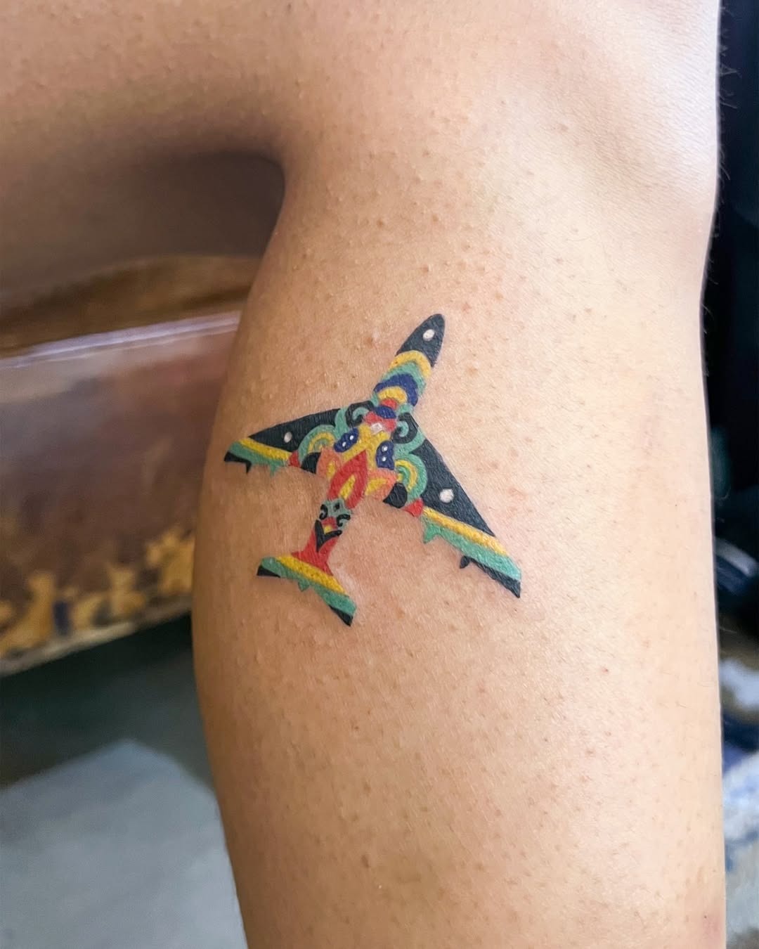 Vibrant airplane tattoo with a unique design Tattoo Design