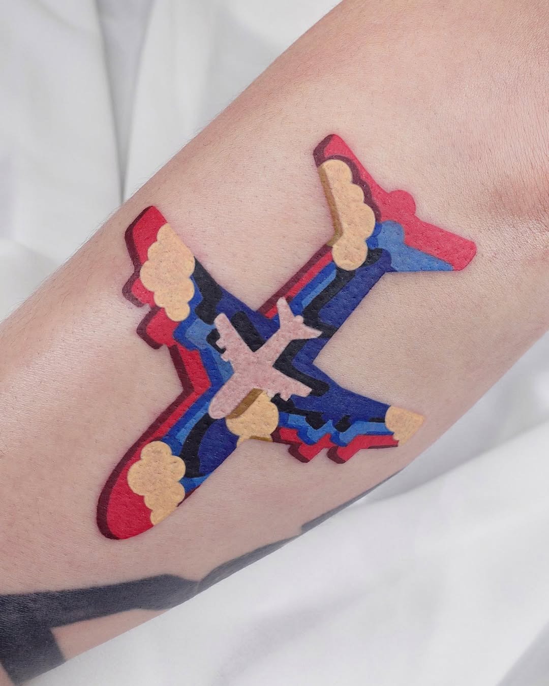 Vivid airplane tattoo showcasing unique artistry Tattoo Design