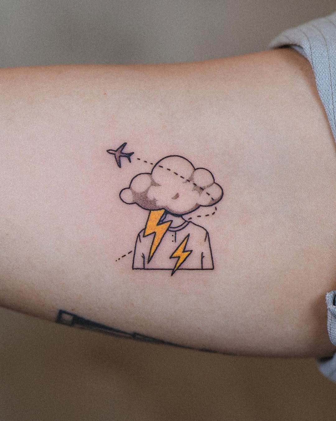 Whimsical airplane tattoo with a thunderstorm theme Tattoo Design