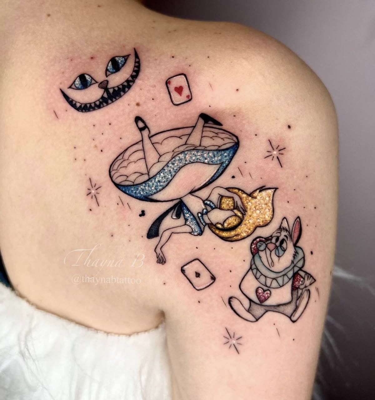 Floating alice With Glittery Wonderland Symbols Tattoo Design