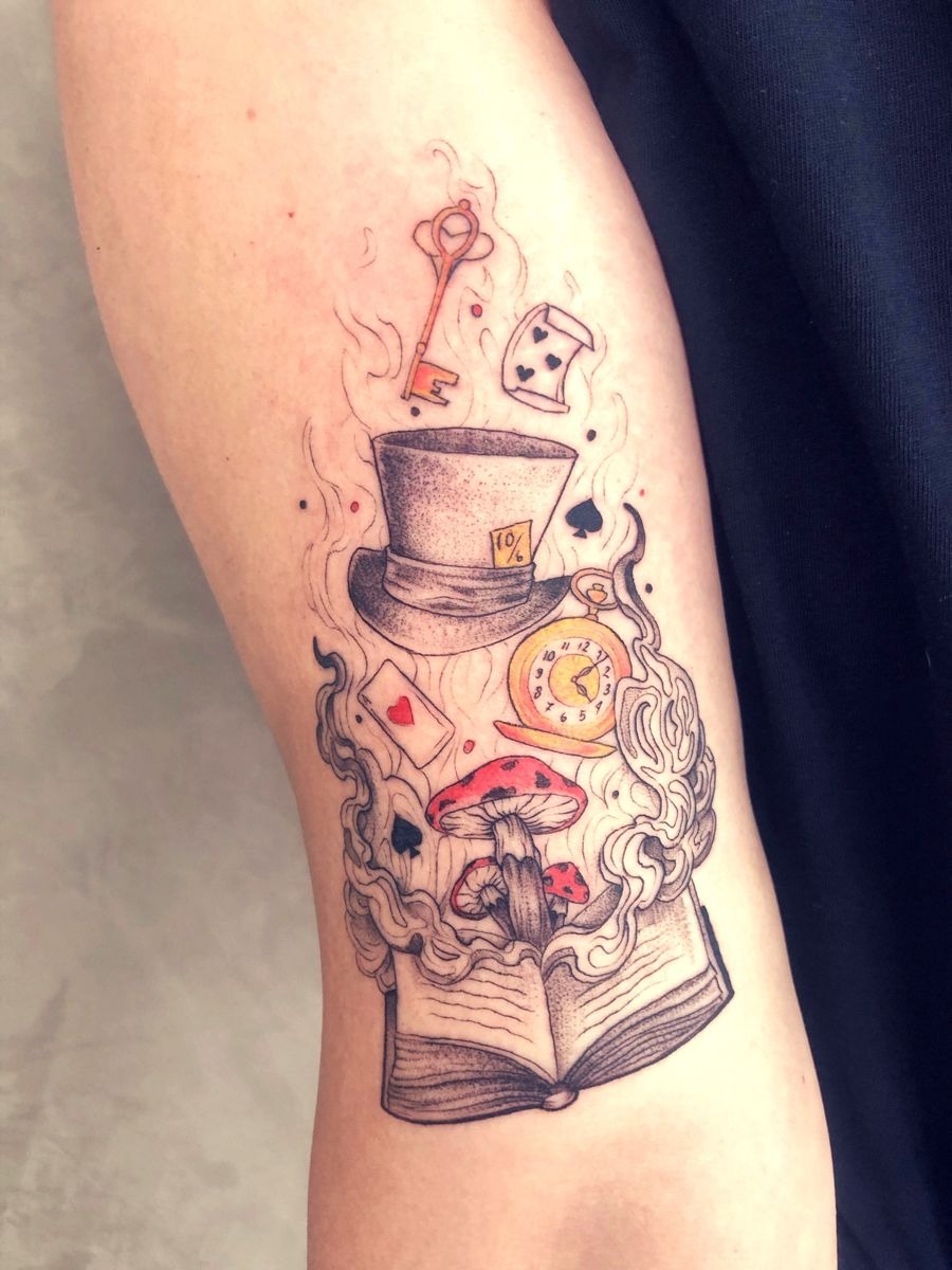 Storybook Relics Rising From an Open Book Tattoo Design