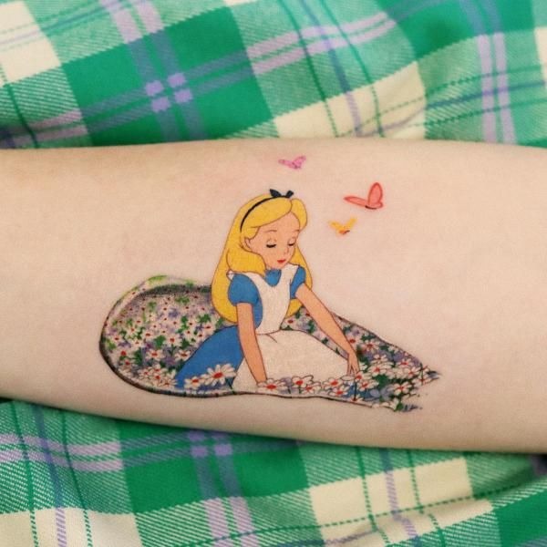Tiny alice Resting in a Bed of Flowers Tattoo Design