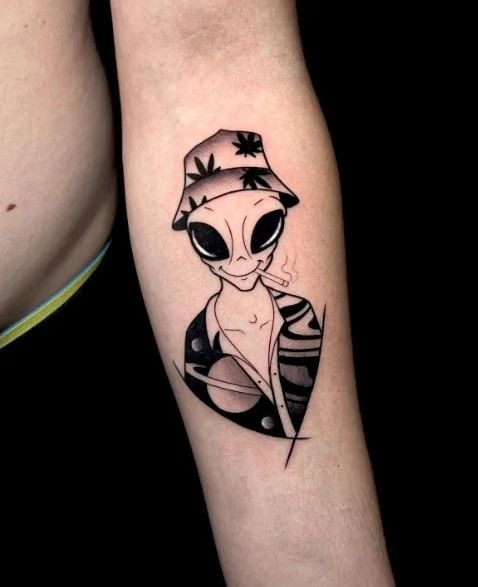 Chill Alien Tourist Tattoo, a tattoo design rendered in clean detailed linework for the hand.