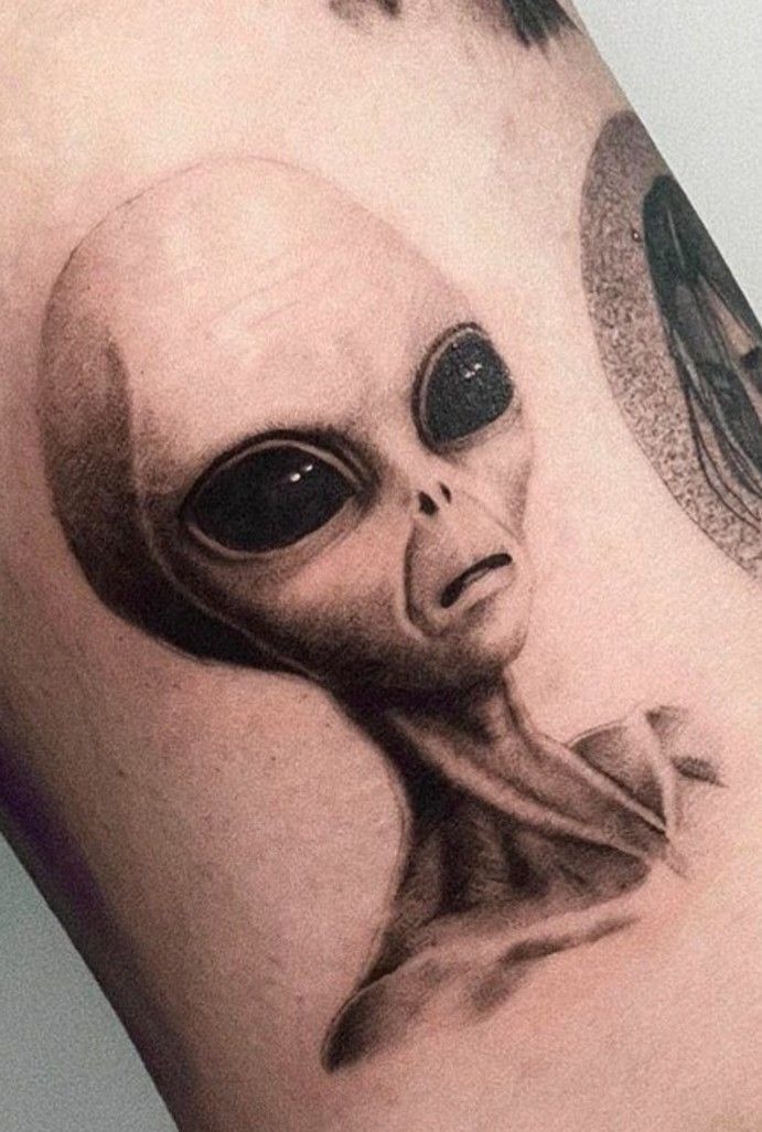 Classic Grey Alien Portrait Tattoo, a tattoo design rendered in realistic portrait-style.
