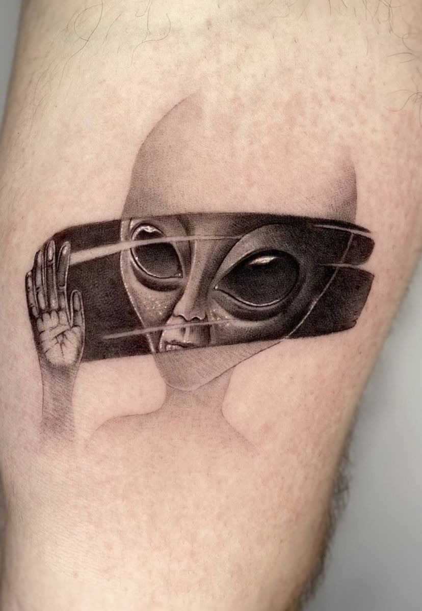 Shattered Reality Alien Tattoo, a tattoo design rendered in clean detailed linework for the hand.