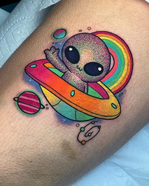 Sparkly Alien in Rainbow Spaceship Tattoo, a tattoo design rendered in clean detailed linework.