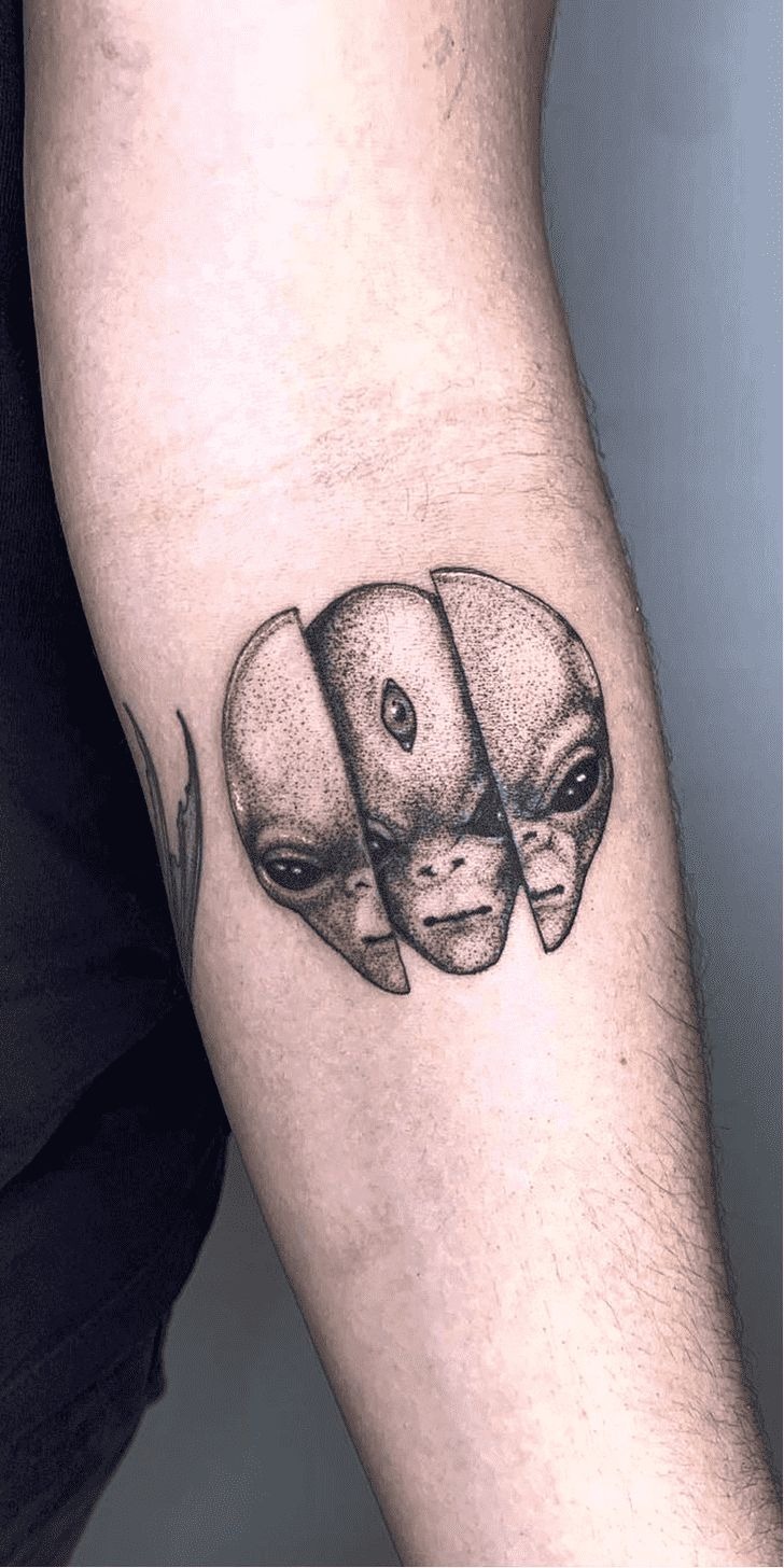 Three-Faced Alien Tattoo, a tattoo design rendered in clean detailed linework.