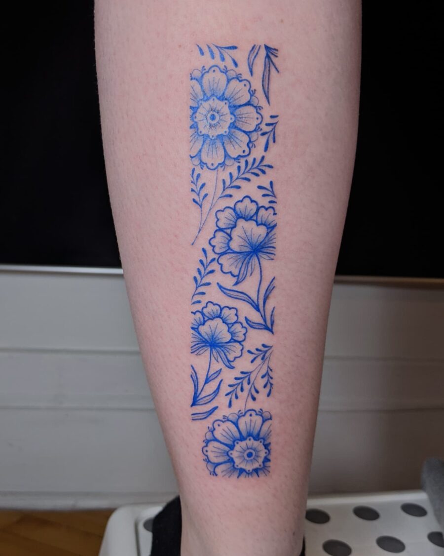 Elegant blue alstroemeria tattoo on leg Tattoo Design