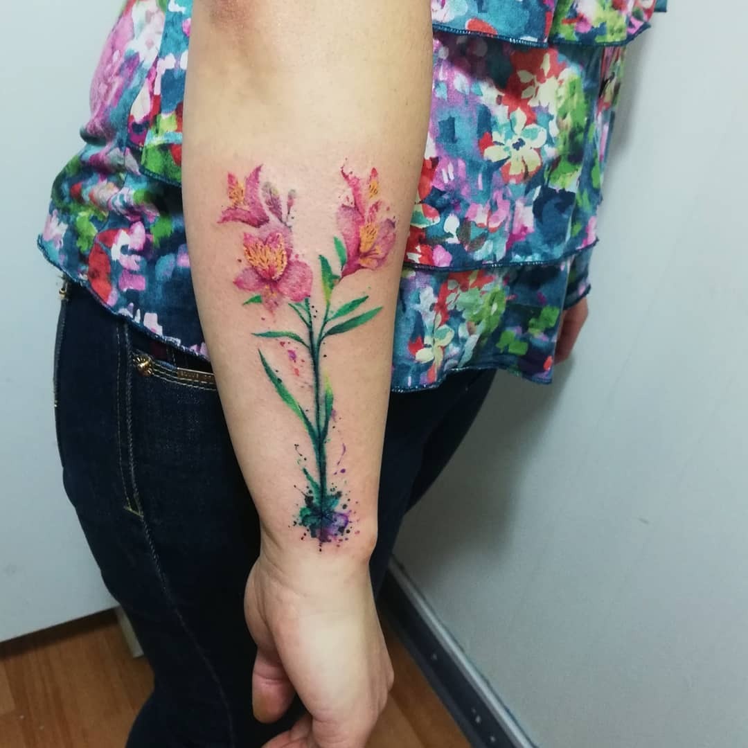 Vibrant alstroemeria tattoo with watercolor details Tattoo Design